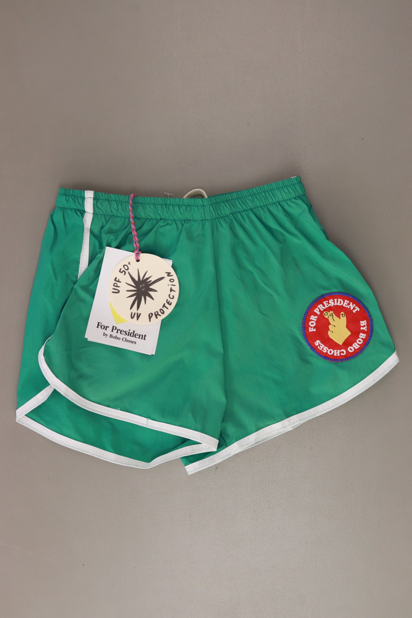 Bobo Choses Kinder Schwimmshorts "Fingers Crossed" grün Größe 6 - 7 Jahre, 122 cm neu mit Etikett