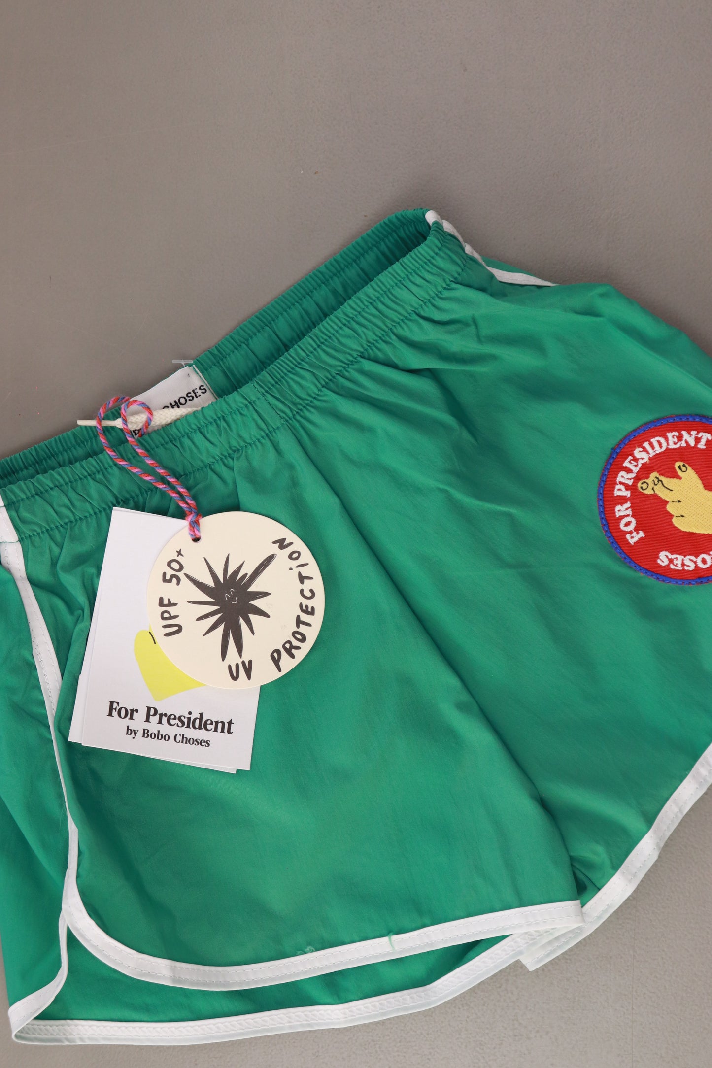 Bobo Choses Kinder Schwimmshorts "Fingers Crossed" grün Größe 6 - 7 Jahre, 122 cm neu mit Etikett